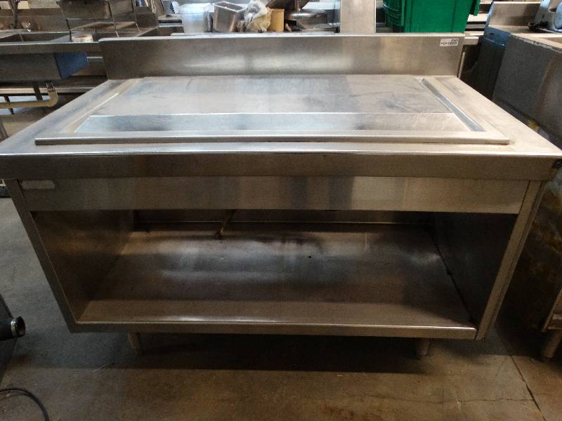 lot 2568 image: 54W x 32D Stainless steel table with 6 backsplash. 18 x 37 cool working surface. No compressor