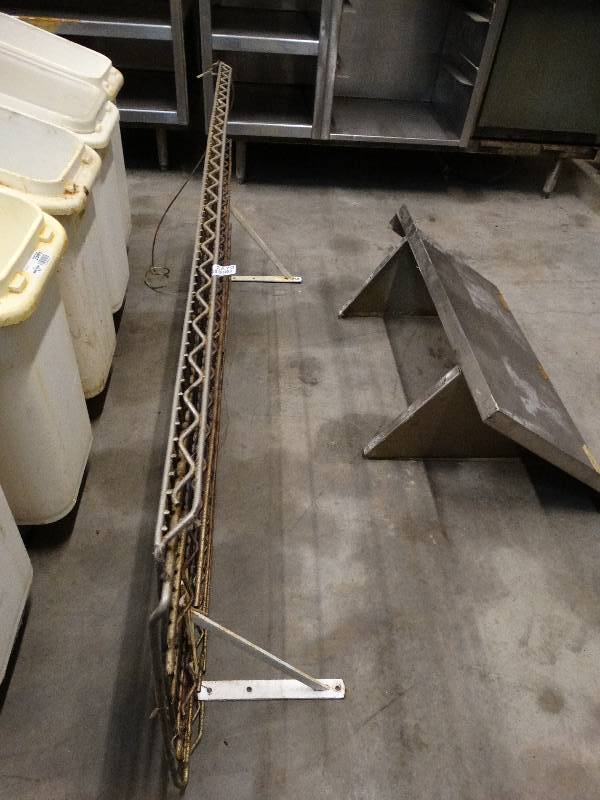 lot 2570 image: 62W x 24D Wire shelf with mounting bracket.