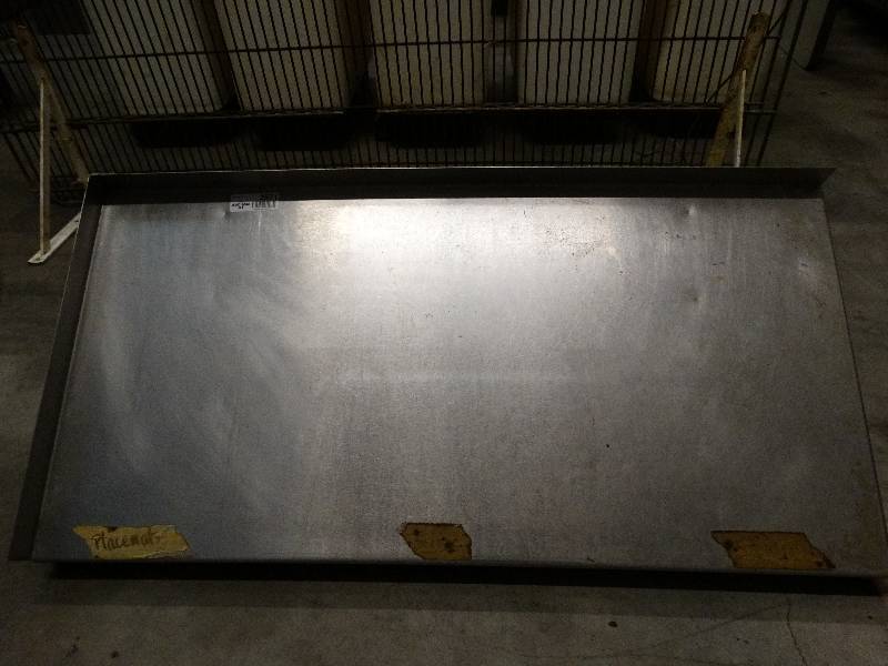 lot 2571 image: 18D x 36W Stainless steel wall shelf with 1.5 backsplash left and back with mounting brackets.