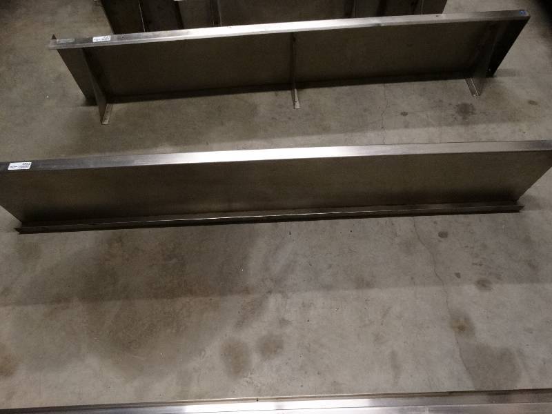 lot 2602 image: 1 only. Stainless steel shelf. Only the shelf centered in the picture dor sale. The shelf to either side of center shelf is not included.