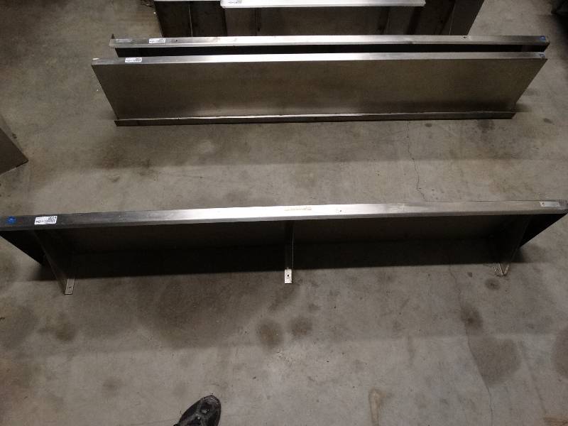 lot 2603 image: 1 only. Stainless steel shelf. Only the shelf centered in the picture dor sale. The shelf to either side of center shelf is not included.