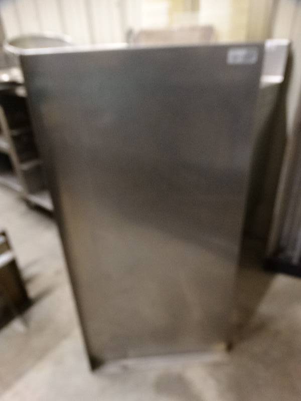 lot 2606 image: Stainless steel shelf with mounting brackets.