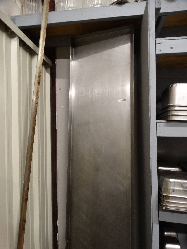 lot 2607 image: Long stainless steel shelf with drain spout and mounting brackets.