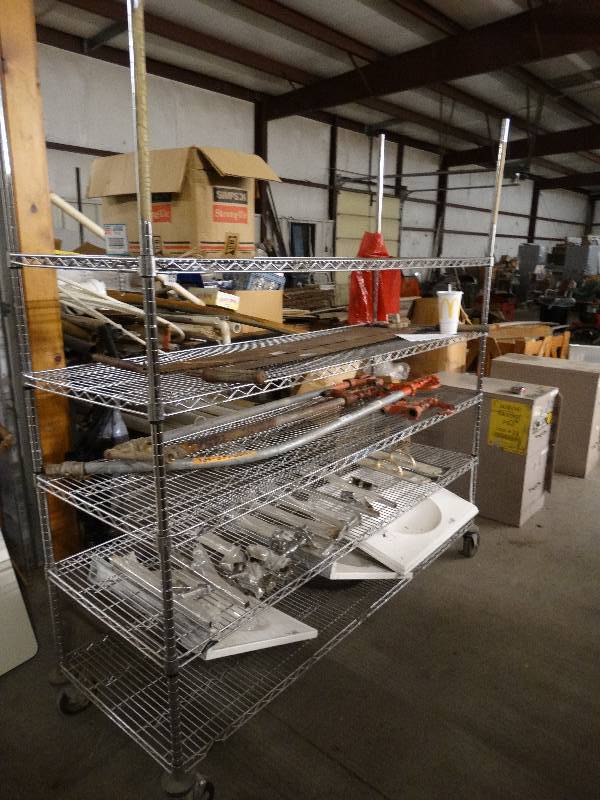 lot 6003 image: Wire Metro Rack with 5 adjustable shelves on casters.