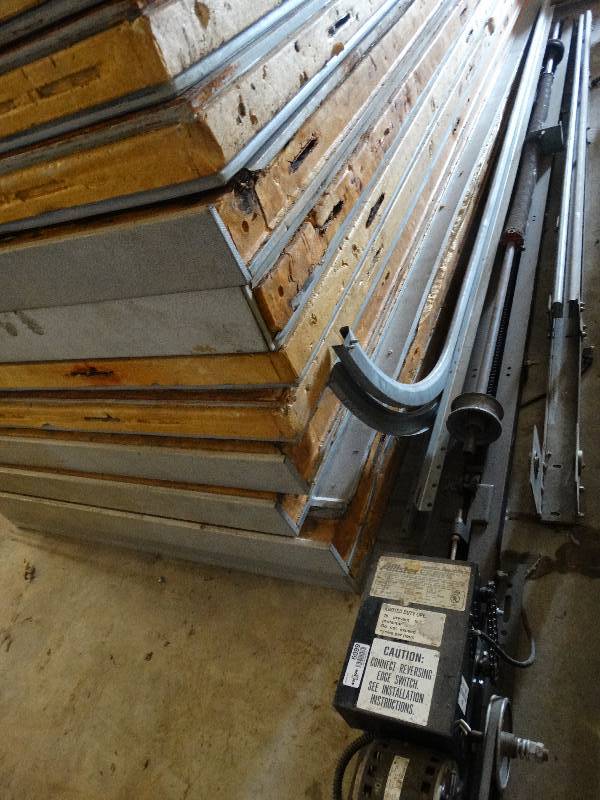 lot 6099 image: Allister commercial garage door opener. M#5MD, 115V,12HP. Door panels, rails and attachments needed for complete system.
