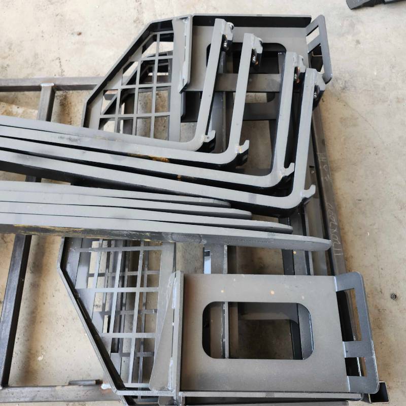 lot 7004 image: Unused Skid Steer Forklift Fork Extensions with Mounting Frame&nbsp