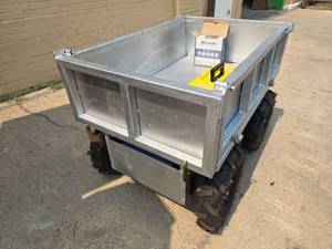 lot 63A image: Unused Heavy Duty Motorized Utility Dump Cart  Remote Control