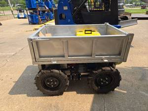 lot 66 image: Unused Heavy Duty Motorized Utility Dump Cart  Remote Control