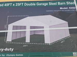 lot 9022 image: Unused 45FT x 25FT Double Garage Steel Barn Shed - Model K4525