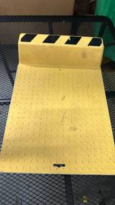 lot 496 image: Plastic Wheel Stop with Adhesive Bottom - Retail $75