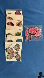 lot 560 image: Bag of Barbie Patches and set of 7 Twist and Fly Butterflies. - Retail $22