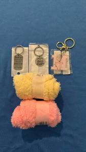 lot 562 image: Set of 3 Key rings and 2 Pair of Fluffy Socks