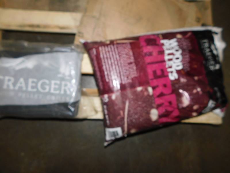 lot 1814 image: Traeger Grill Cover And Bag Of Pellets
