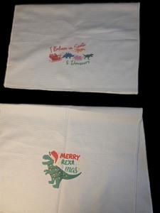 lot 1198100 image: NOQL Christmas Dinosaur Kitchen Towels and Dishcloths Set of 2, Bathroom Decor, Gifts for Boys, Merry Rexmas Santa T Rex Drying Cloth Hand Towels, 16x24 Inch - Retail $12