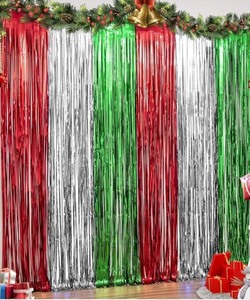 lot 1198253 image: 3 Pack Christmas Party Decorations, 3.3 x 6.6 ft Christmas Foil Fringe Curtains with Christmas Banner, Red Silver Green Tinsel Streamers Christmas Backdrop Photo Party Supplies for Christmas - Retail $8
