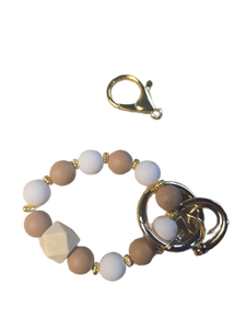 lot 1198354 image: TrustBlai Keychain Wristlet, Silicone Beaded Bracelet Keychain, Elastic Bangle Bracelet Key Rings for Women - Retail $8