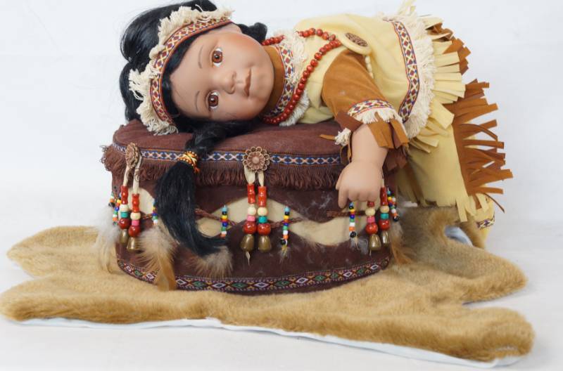 lot 3431 image: Collectible Indian Baby On Drum Showing Bare Butt Made Of Porcelain