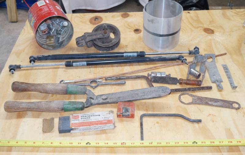 lot 2465 image: Misc Lot - Contents of Table - Shears - Wheel - Wrench - Sharpening Stone and More Take a Look