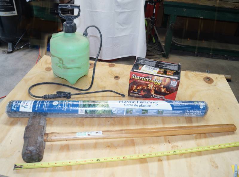 lot 2469 image: Misc Lot - Contents of Table - Fireplace Starter Logs NEW - Plastic Fencing - Sledge Hammer & Weed Sprayer