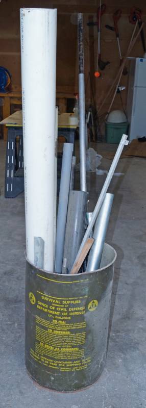 lot 2487 image: Survival Supplies Department of Defense Metal Can - Filled With Scrap Pipe and Poles