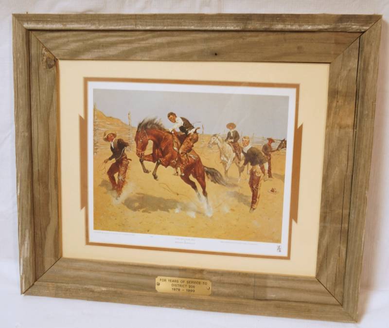 lot 2578 image: Framed Print by Frederic Remington TURN HIM LOOSE, BILL - In a nice barn-wood frame - great condition