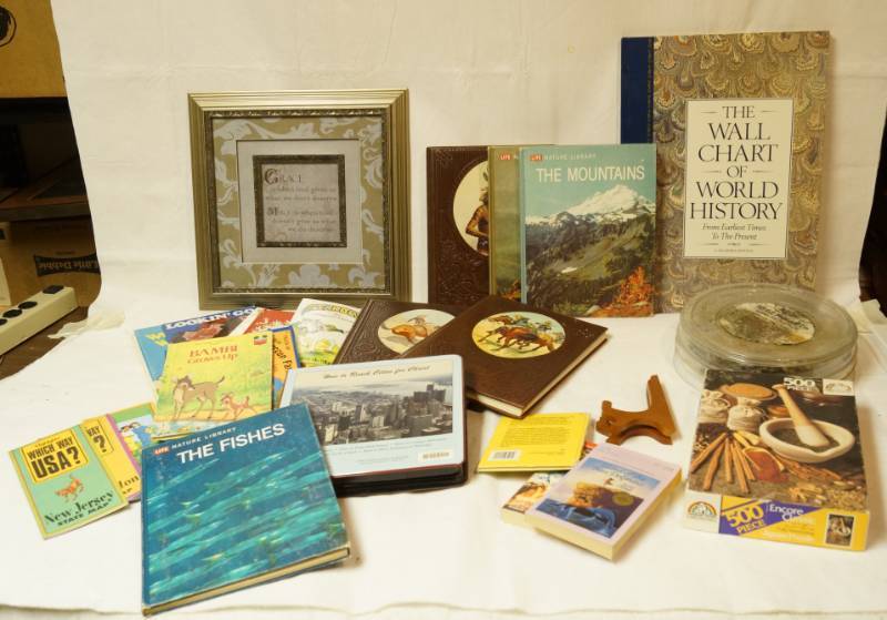 lot 2580 image: Lot of Western Reference Books, Misc Wall Hangings, Puzzles and more - good stuff