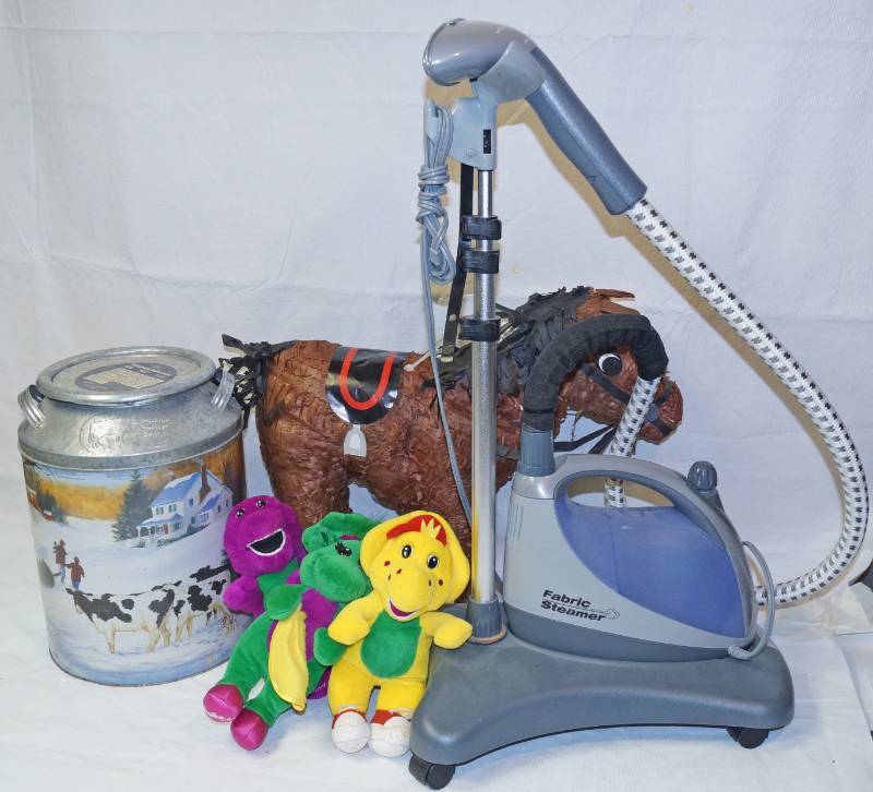 lot 2587 image: Fabric Steamer (nice, on wheels w manual - telescoping wand holder) - pinata, animals and repro milk bucket tin - cool