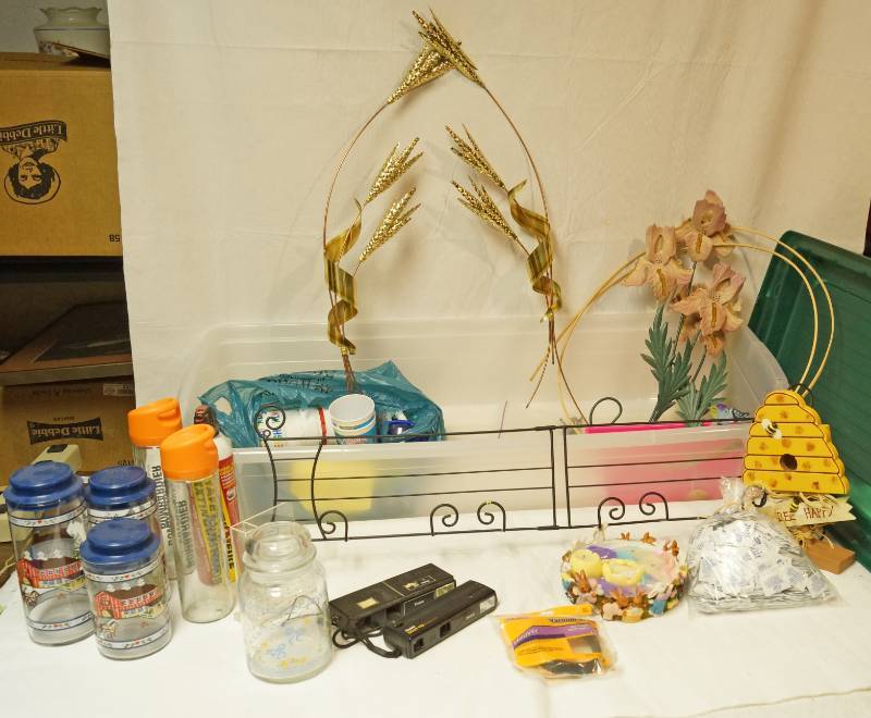 lot 2590 image: Lot of Home Decor - Home Interiors, Wire shelf, Vintage Glass Canisters, plastic cups, vintage cameras and more