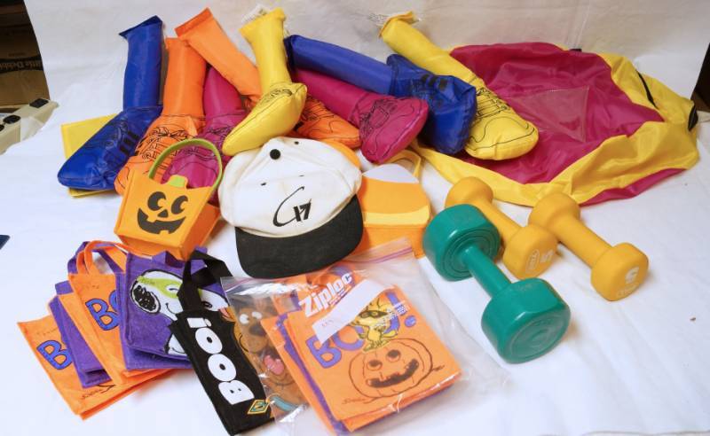 lot 2609 image: Lot of Exercise Dumbells, Stuff Legs w Velcro and Halloween Treat Bags - FUN