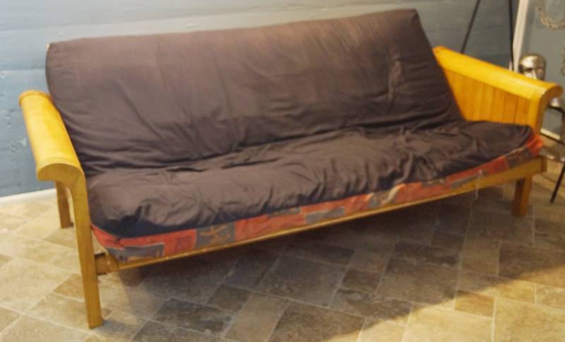 lot 2704 image: Futon - first its a couch, then its a bed