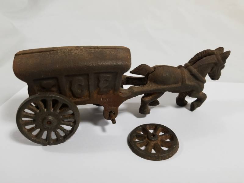 lot 8030 image: Cast Iron Ice Buggy  Wheel coming off
