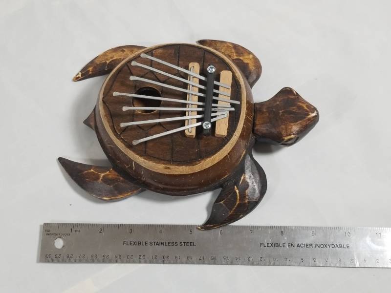 lot 8144 image: 9 Wood Turtle Thumb Instrument  Sounds Good