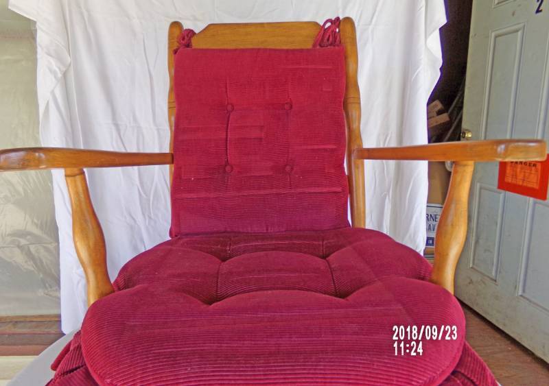 lot 9073 image: wooden rocker with red cushions