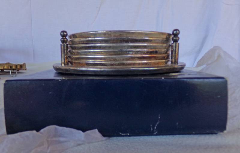 lot 9131 image: silver looking coasters