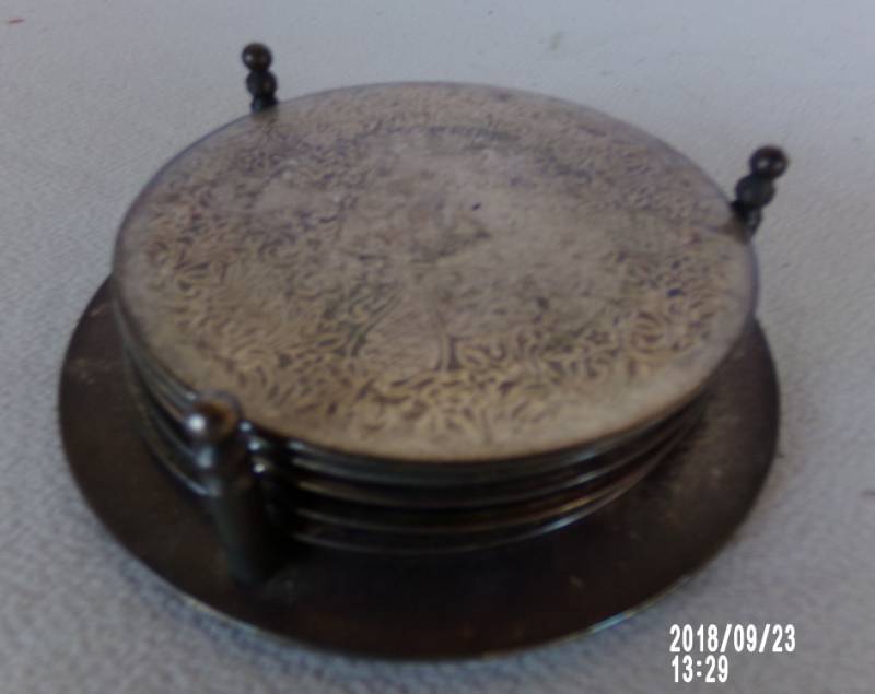 lot 9133 image: silver looking coasters