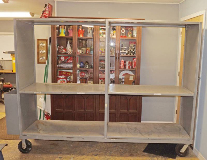 lot 6065 image: Commercial Warehouse Stocking Rack - Almost 9 long Over 6 Tall - 2 wide - w floor brake - Rolls Nice - One shelf corner needs a bracket - Otherwise EXCELLENT condition