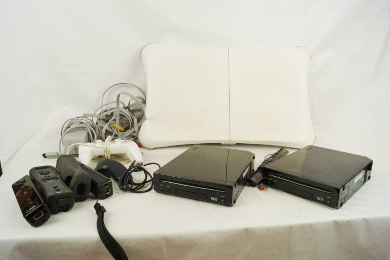 lot 6093 image: Lot of 2 Nintendo Wii Systems ad various cords and controllers - see pics