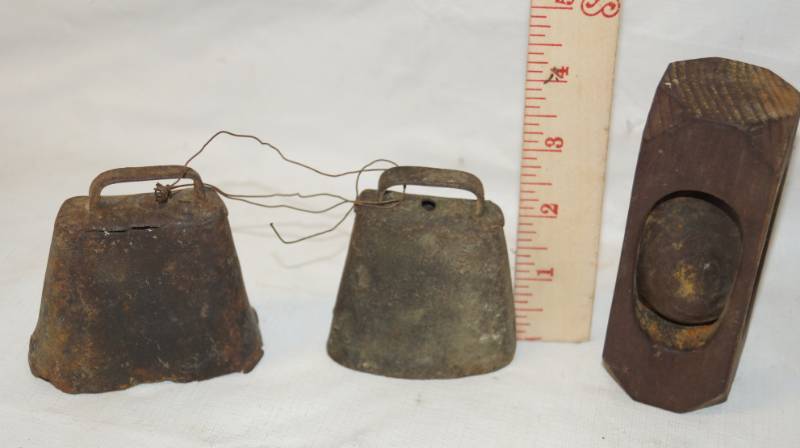 lot 5878 image: Lot of 2 Old Goat Bells and a Wooden Item - Hallowed out with a wood egg shape inside Use unknown - its old