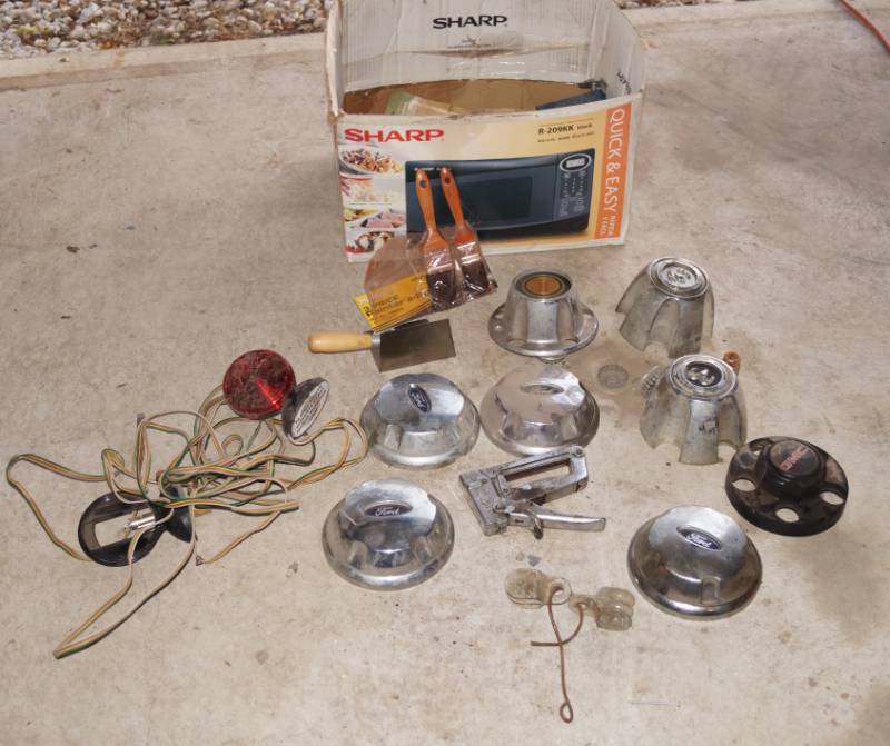 lot 5920 image: Lot of Hubcaps, Staple Gun and 2 new paintbrushes