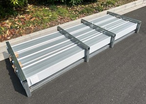 lot 939 image: Unused 100 pieces of 10 foot long Corrugated Steel Panels.  41 inch by 10 foot long panels