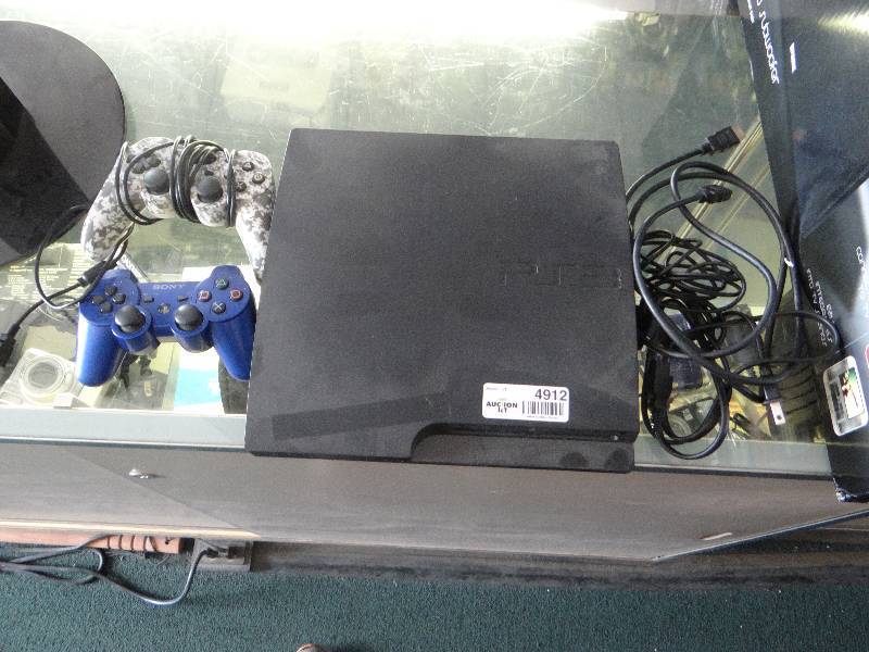 lot 4912 image: Playstation 3 w 2 controllers & power cord
