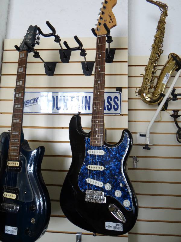 lot 4990 image: Squier Strat by Fender electric guitar