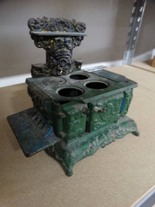lot 13297 image: Miniature cast-iron stove replica.