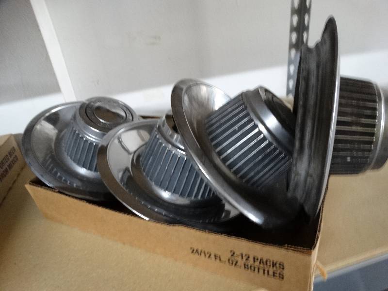 lot 13300 image: Lot of chevy center caps.