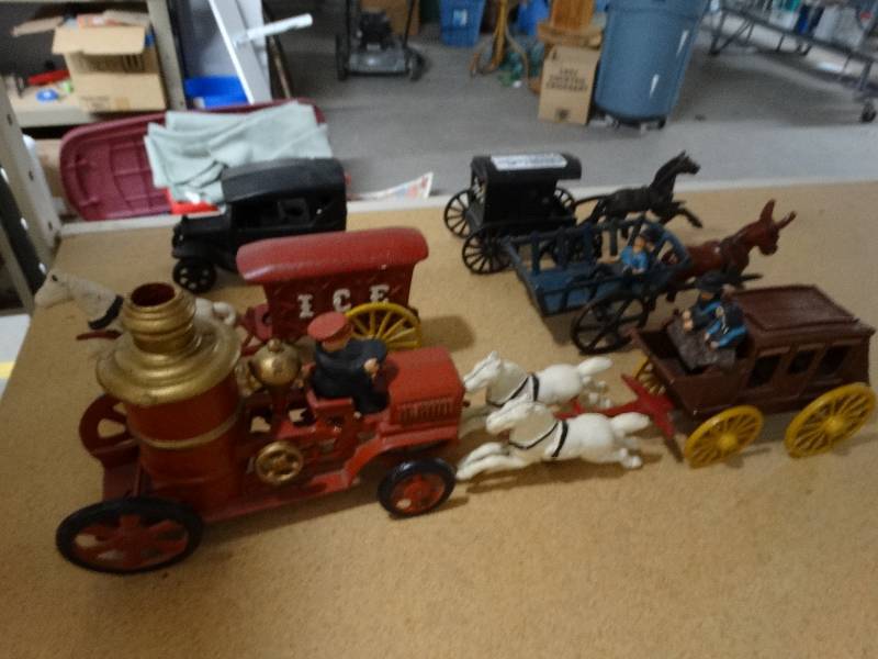 lot 13344 image: Cast iron horse and carriage and cars.
