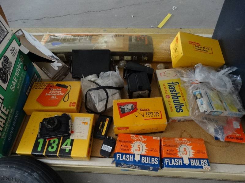 lot 13363 image: Large lot of camera equipment and curtains and extension cords.