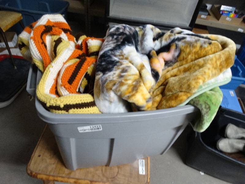 lot 13423 image: Tote full of blankets.