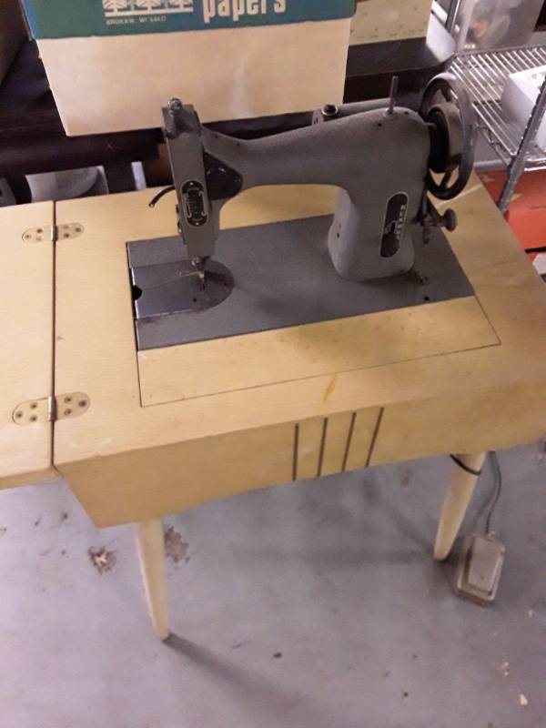 lot 33345 image: Vintage Kenmore Sewing Machine with Cabinet, does not power on.