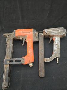 lot 1537 image: Vintage Pneumatic Nail Guns - Orange and Silver Pair