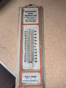 lot 663 image: Vintage S.W. Bell Telephone Company Warning Thermometer